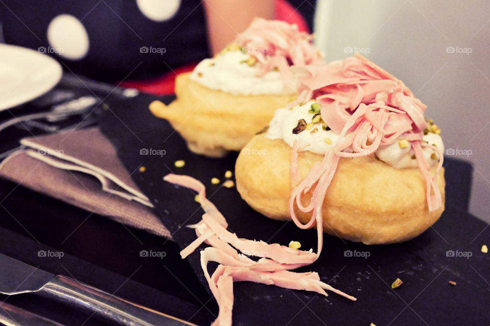 Italian fried pizza with cheese, pistachio and mortadella