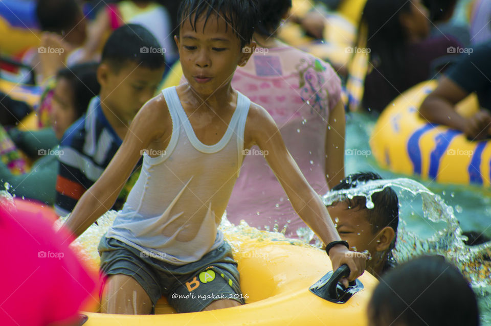 Boy holding tub