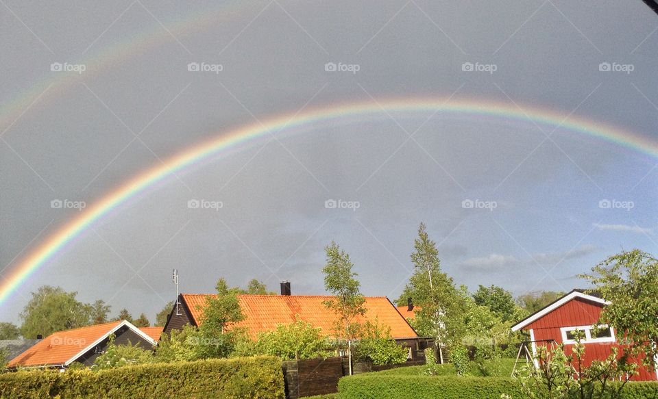 Rainbow. Rainbow, rainbow, sun, sky,house, garden