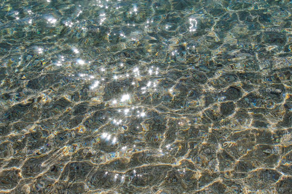 A view from above of the full frame of the sea.  Tranquility scene,  sunny lights