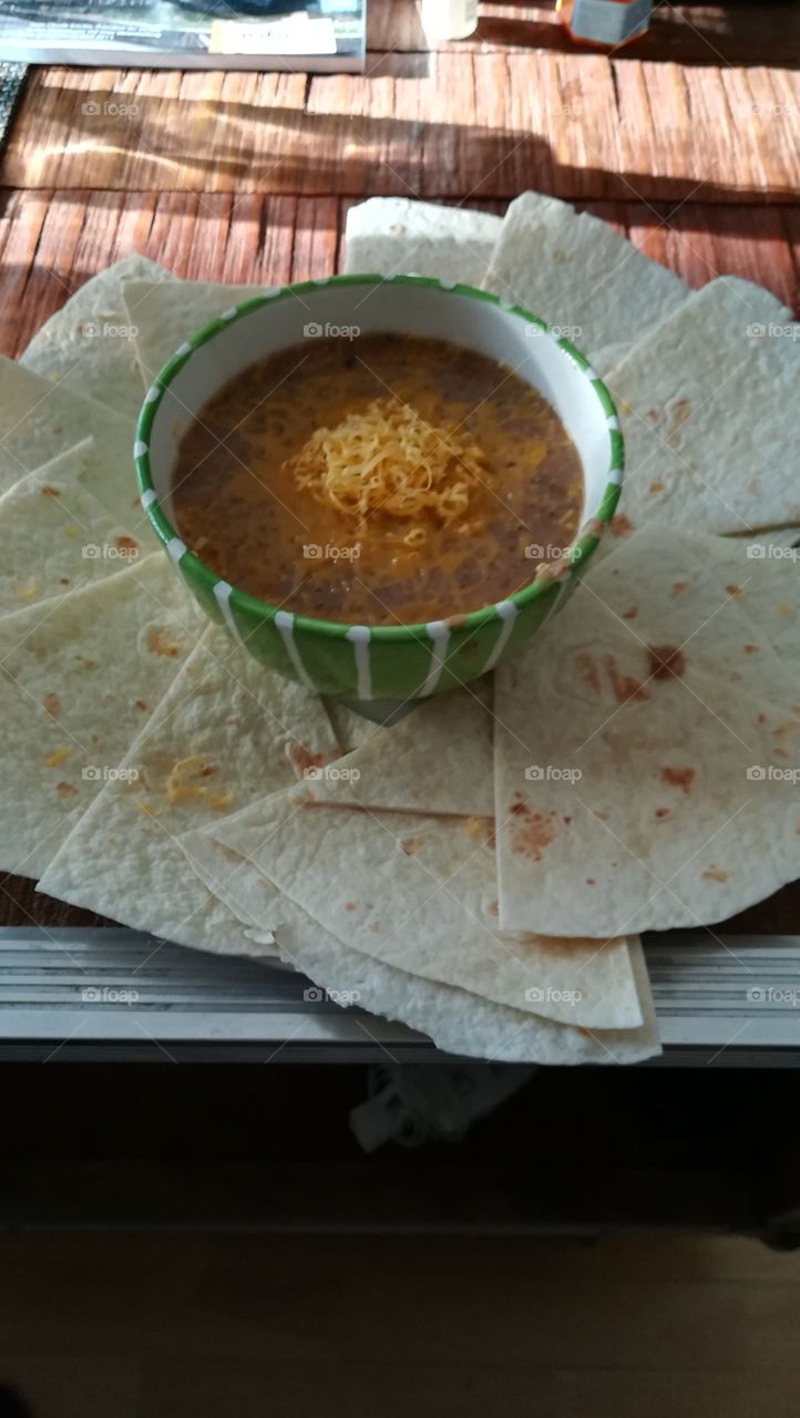 homemade refried beans with melted cheese.