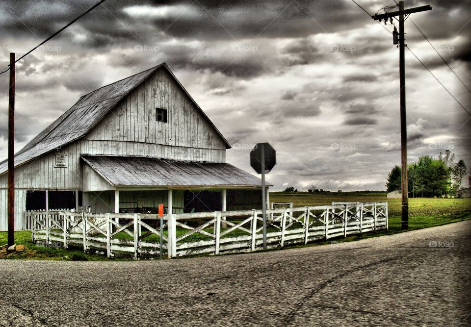HDR farm house with white fence