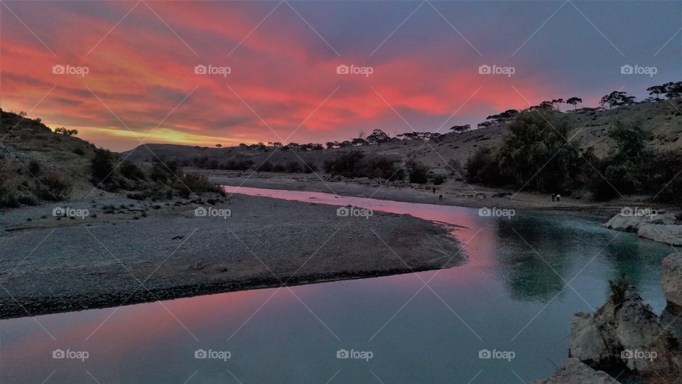 sunset reflected in river
