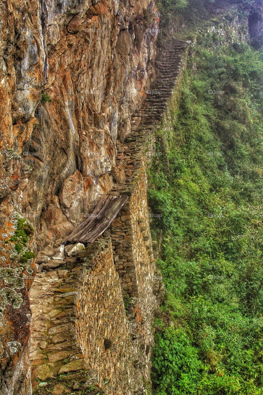 View of a stairs on rocky wall