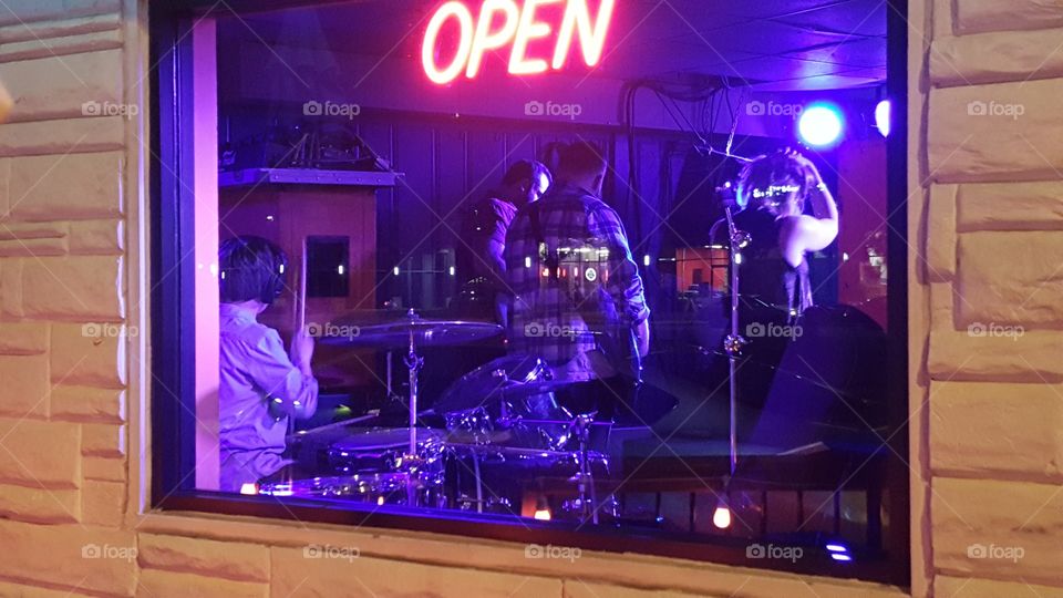 band in the window. out at night