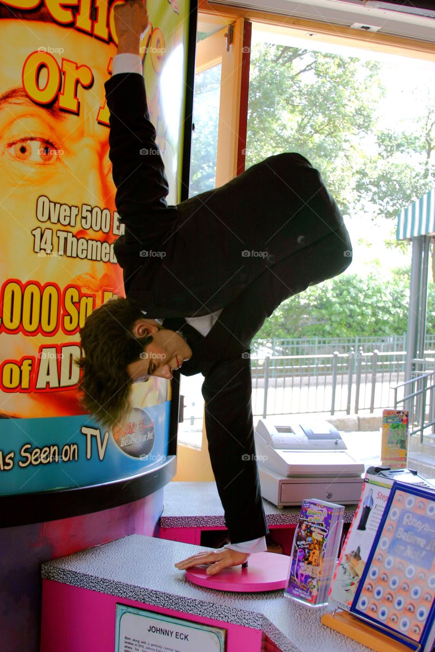 Waxwork of acrobatic man born without legs