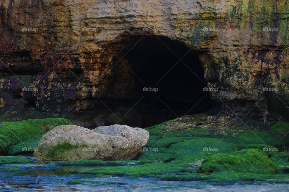 cavern. eroded mountain by sea waves