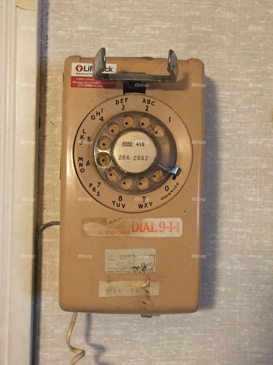 Same picture but with the dialer, hook, and numbers visible. It's neat to see faded stickers, too.