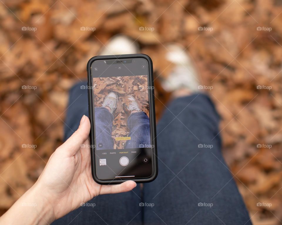 Outdoors taking photos in the leaves  