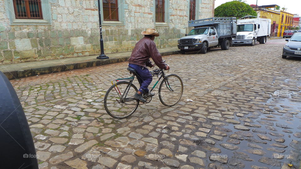 Pueblo biker somewhere in Mex. Biker in the streets of a mexican pueblo