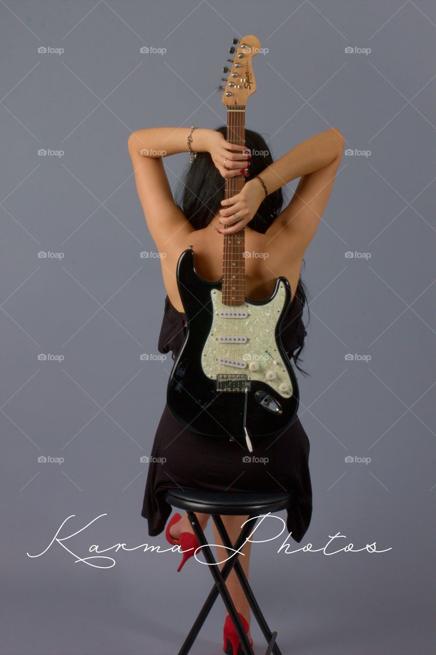 The Guitar. Red heels and Guitar