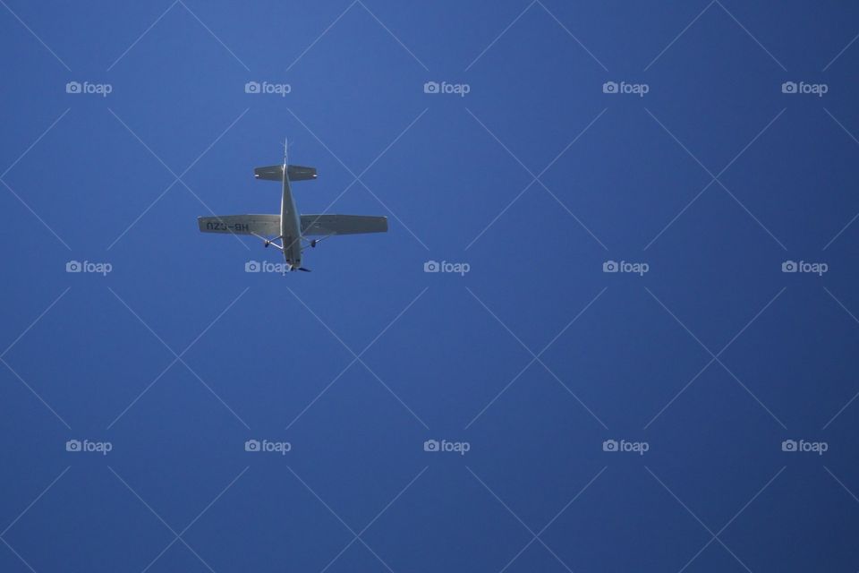 Low angle view of airplane flying in clear sky