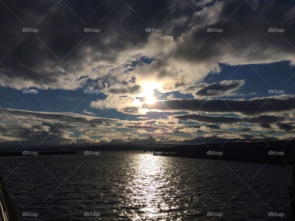 Scenic view of sea against cloud sky