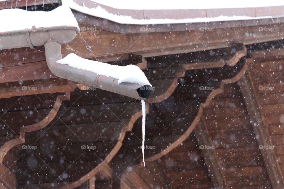 Icicle hanging on the water pipe