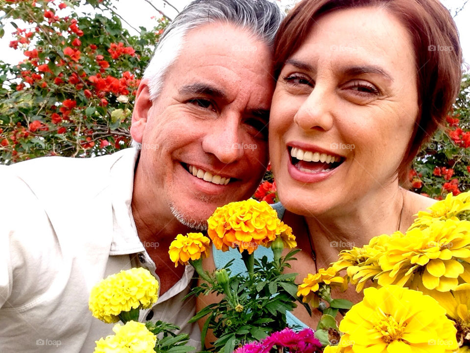 Couple with flowers in the garden