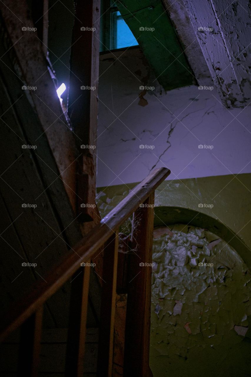 A staircase of an old abandoned house