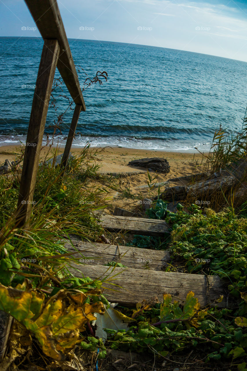 Descent to the seaside along the old wooden stairs