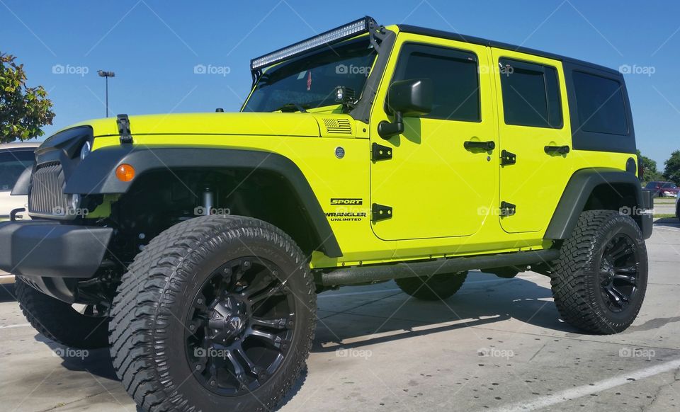 Jeep wrangler sport,  big wheels, 
 high and bright color