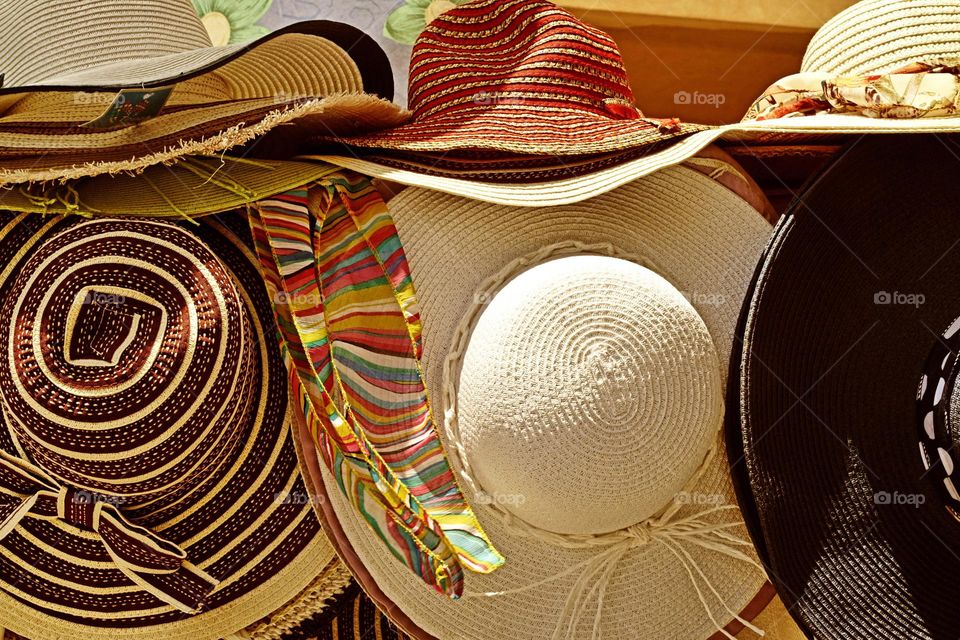 Variety of hats for sale in market