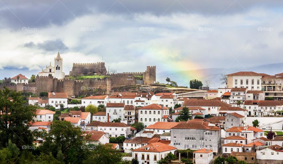 Rainbow over the town and historic castle at Penela, Central Portugal