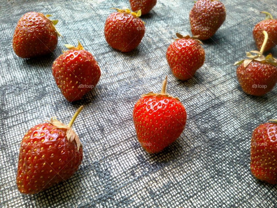 Strawberries arranged on textile