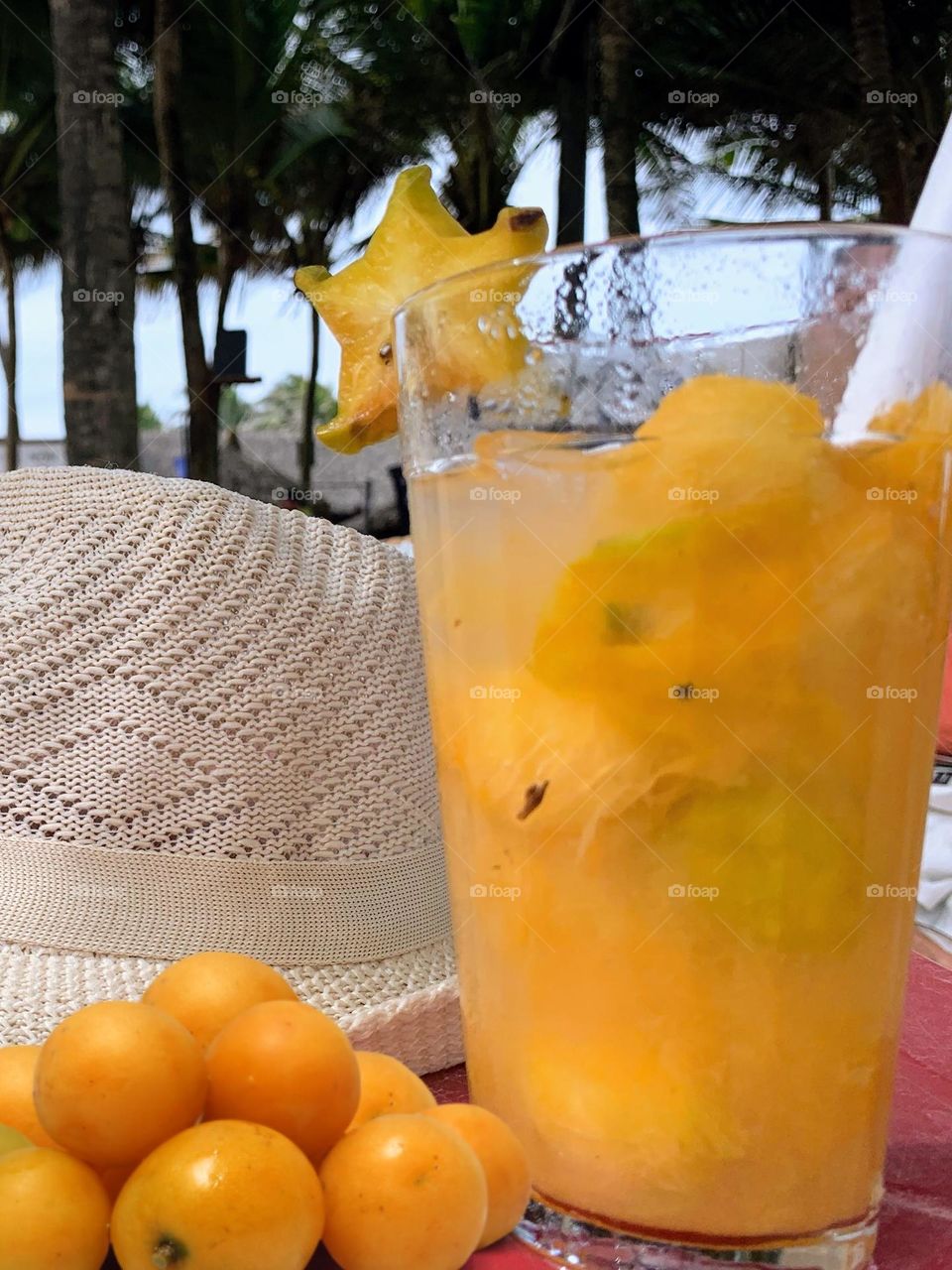 Caipirinha de Cajá on the beach