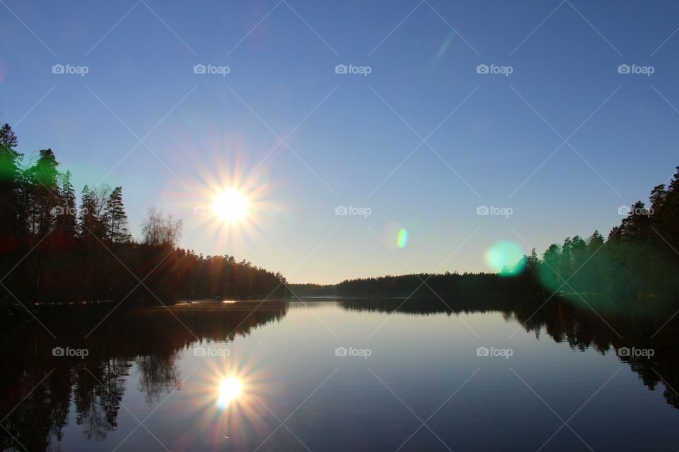 sunrays reflection on lake