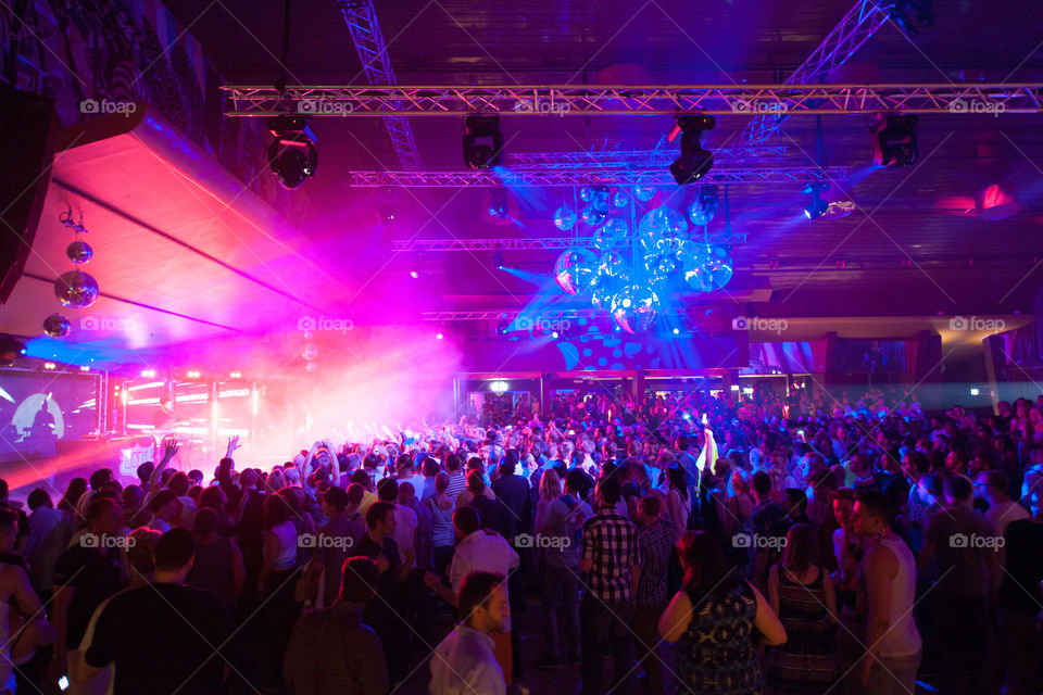 Nightclub with live performance. Over a 1000 people dancing to house DJs.