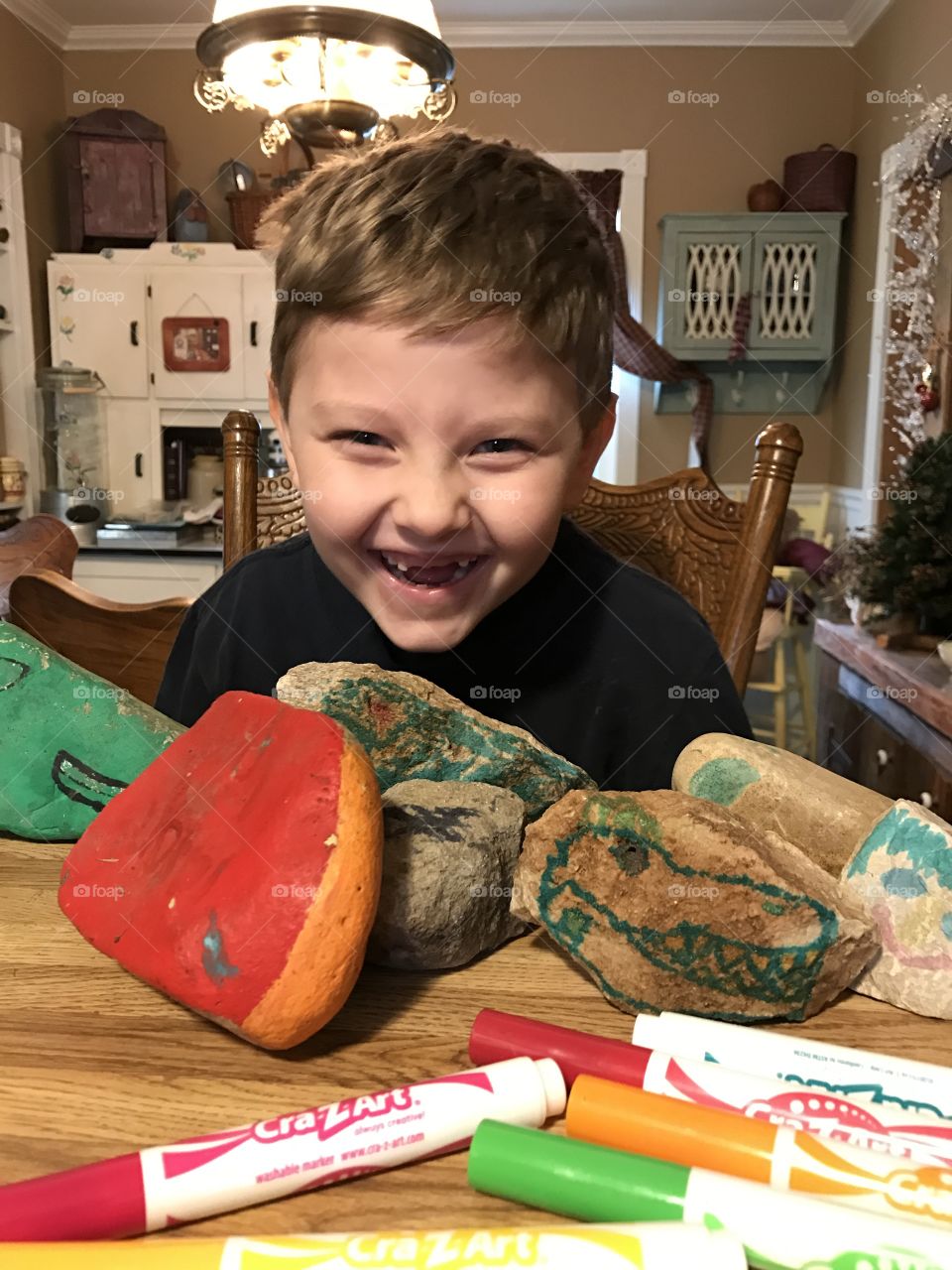 Painting rocks with mason monster 
