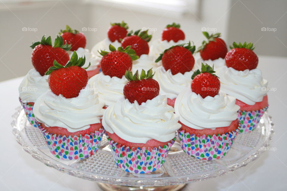 Strawberry and Jello Cupcake with Whipped Cream and Strawberry Garnish