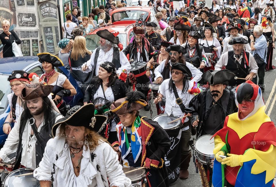 A very large number of people dressed as pirates, with the odd parrot, at the annual Pirate Day in Hastings, UK 