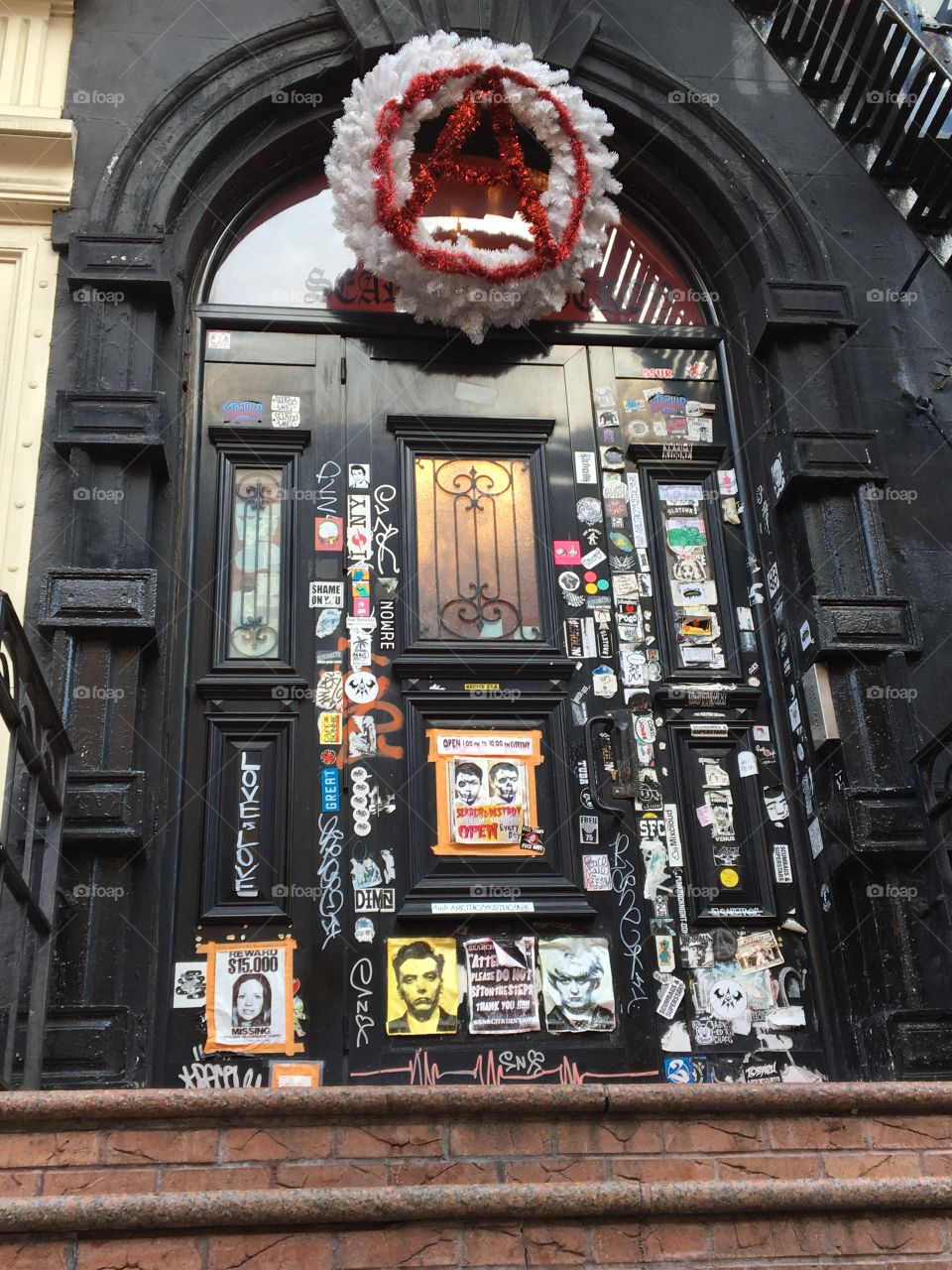 Front door of search and destroy before Xmas, complete with an anarchist Xmas wreath 