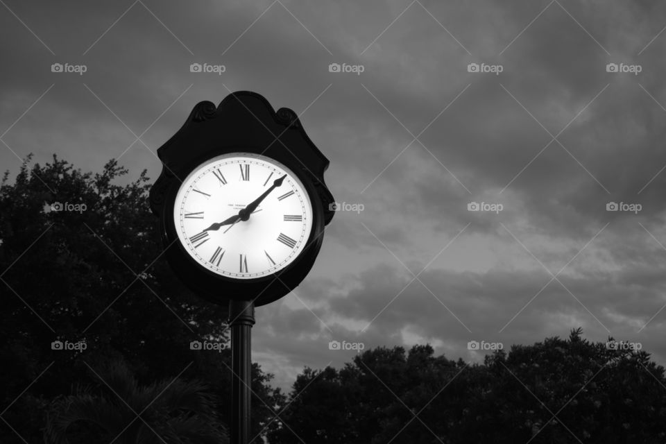 Night sky clock where time is stopped with the dark sky containing all the m