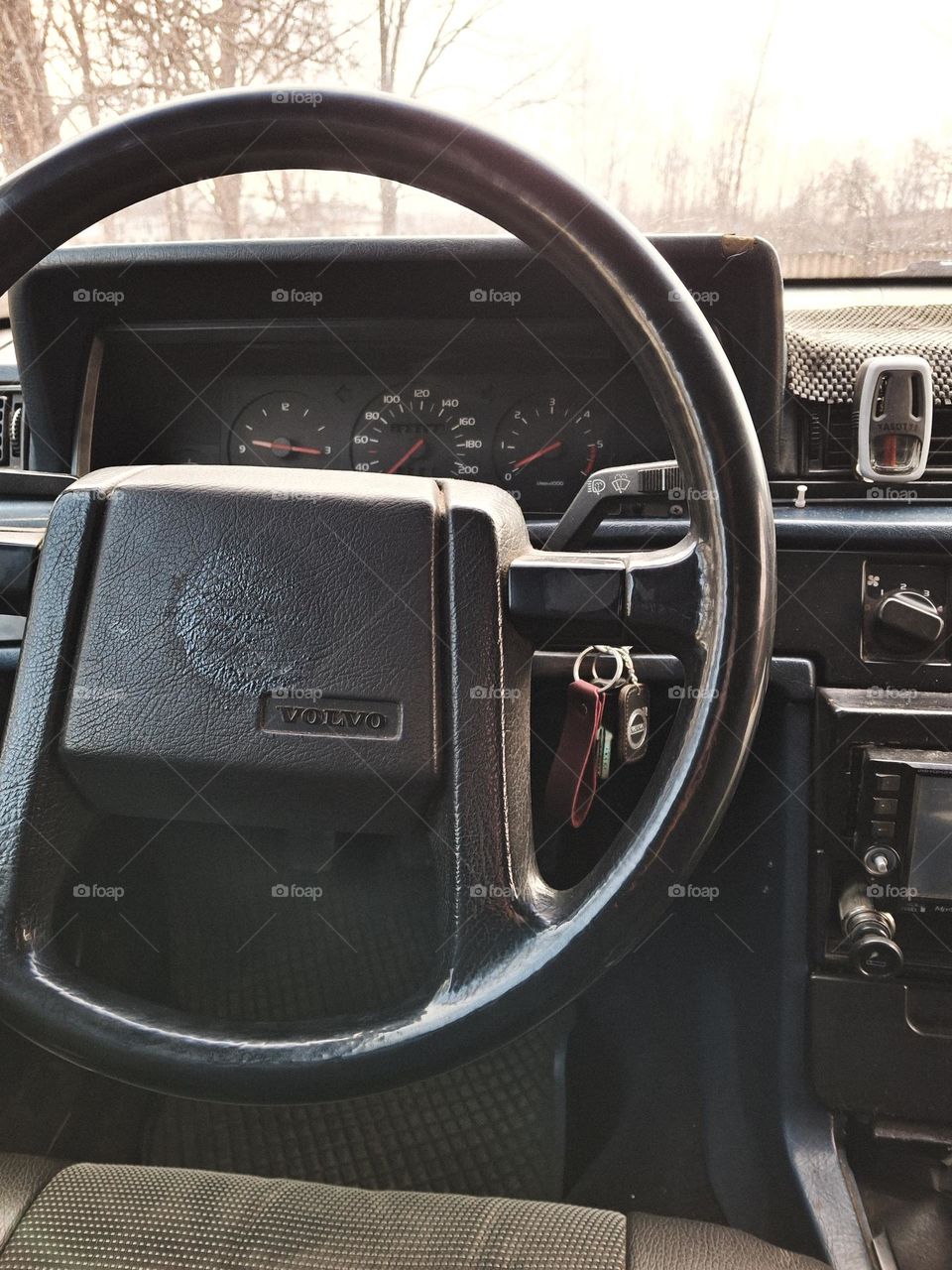 dashboard and old steering wheel of a retro car, namely a 1986 Volvo