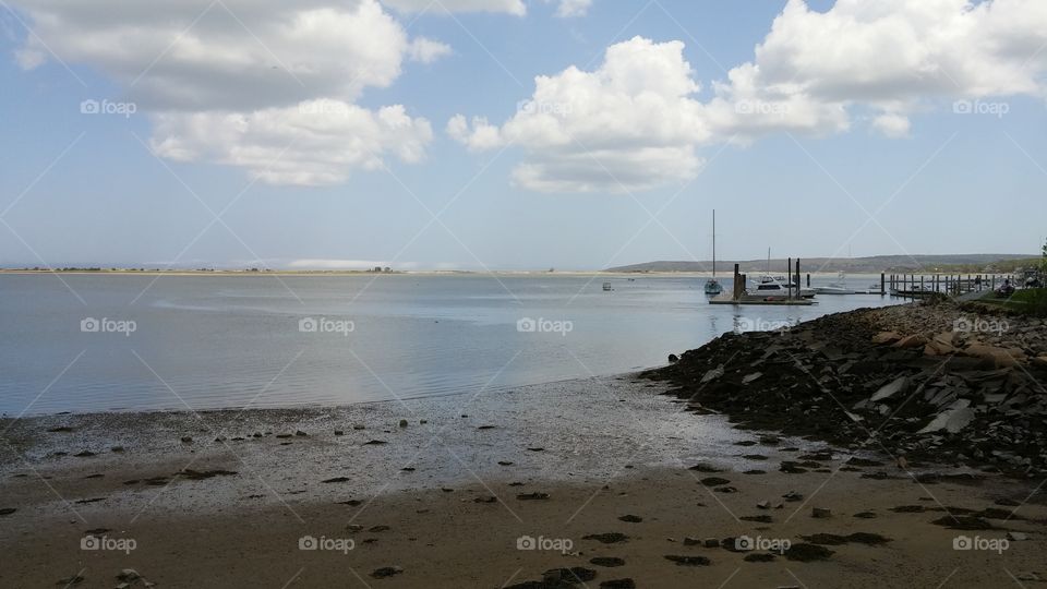 Peacefull beach near Plymouth, MA, USA with somes clouds in the sky