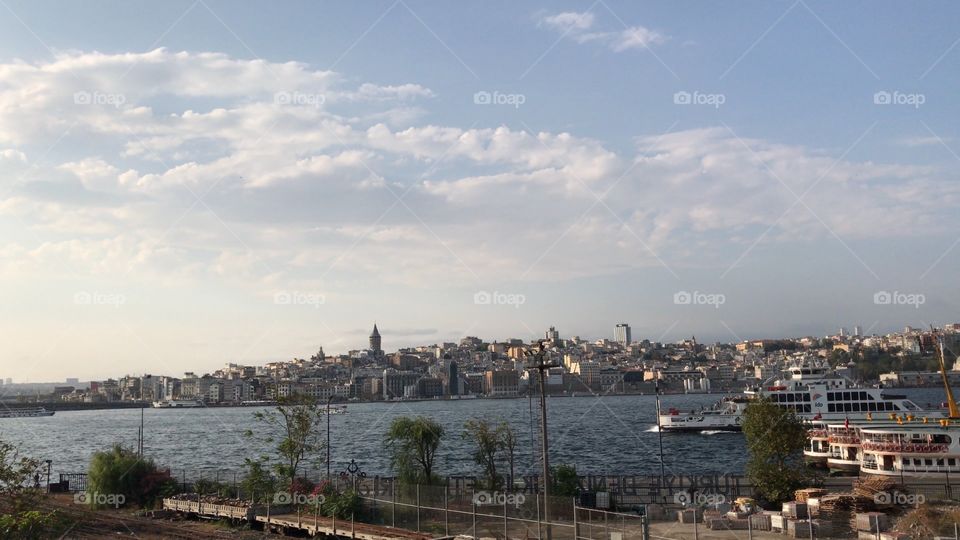 Istanbul city view. Galata bridge, boat at sea. Fresh air.