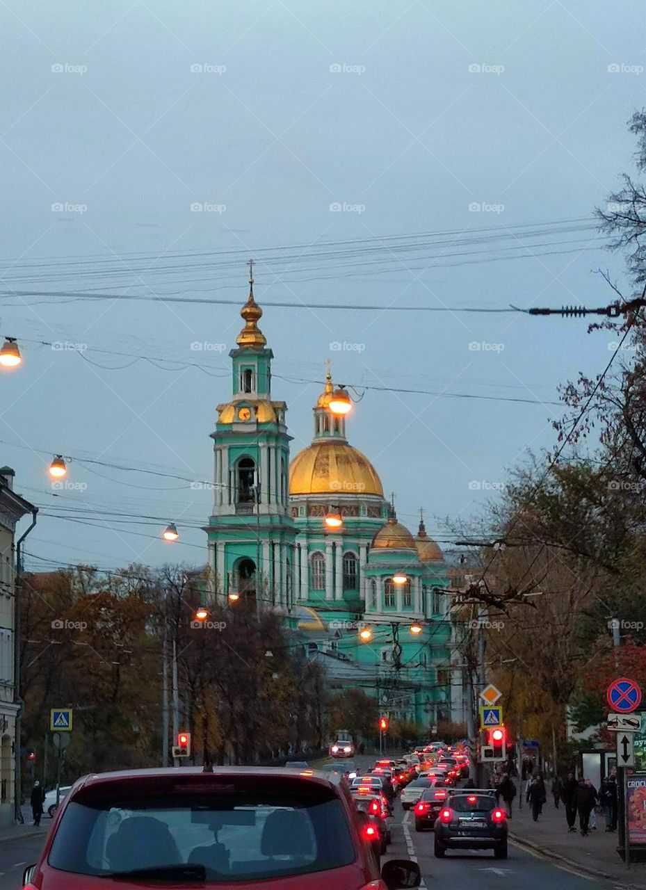 A trip in a car. Evening road in Moscow. Traffic jam. Yelokhovsky Cathedral ahead