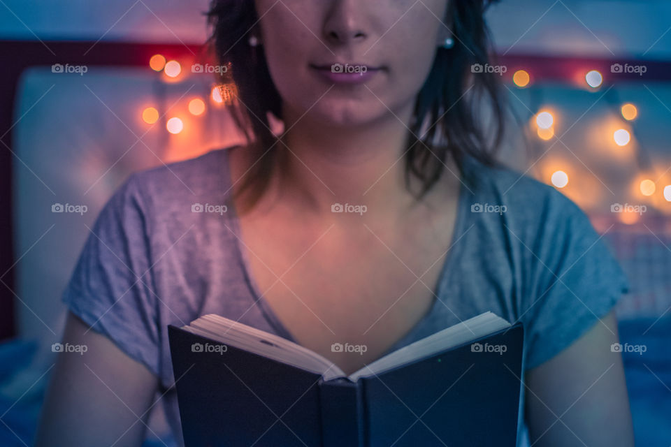 Young woman reading a book