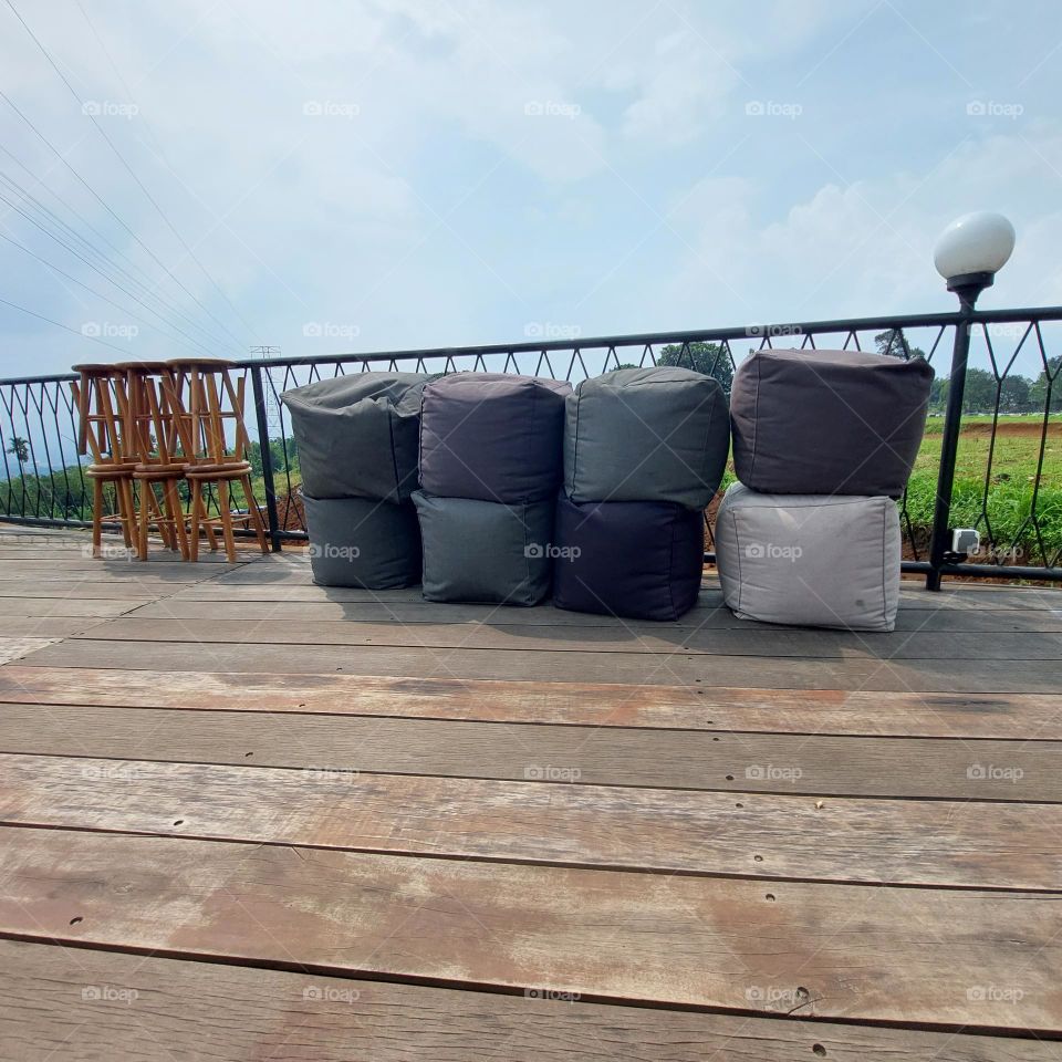 outdoor cafe table chairs in bogor with a view of geulis mountain