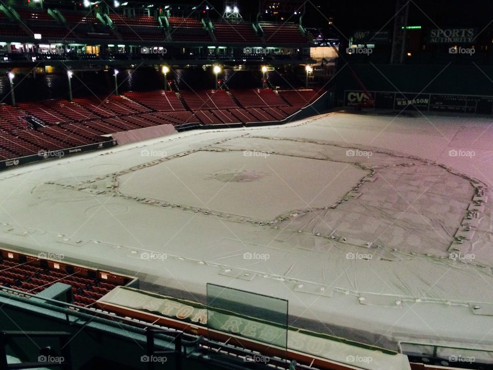 Fenway Park infield covered in snow.