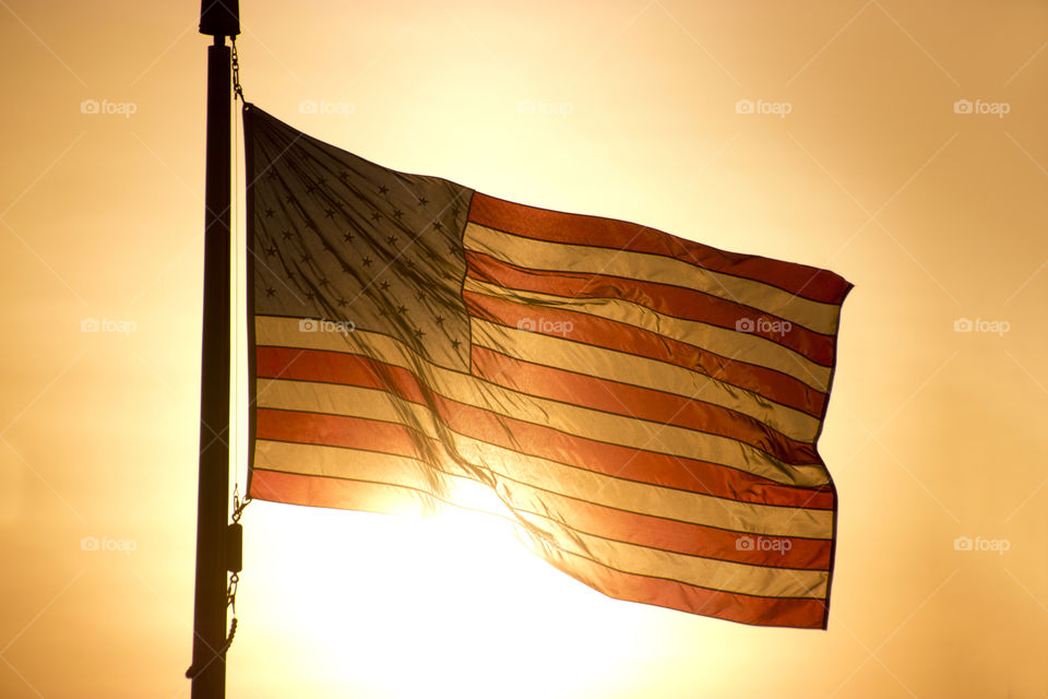 Shining flag, flag silhouette, sunset