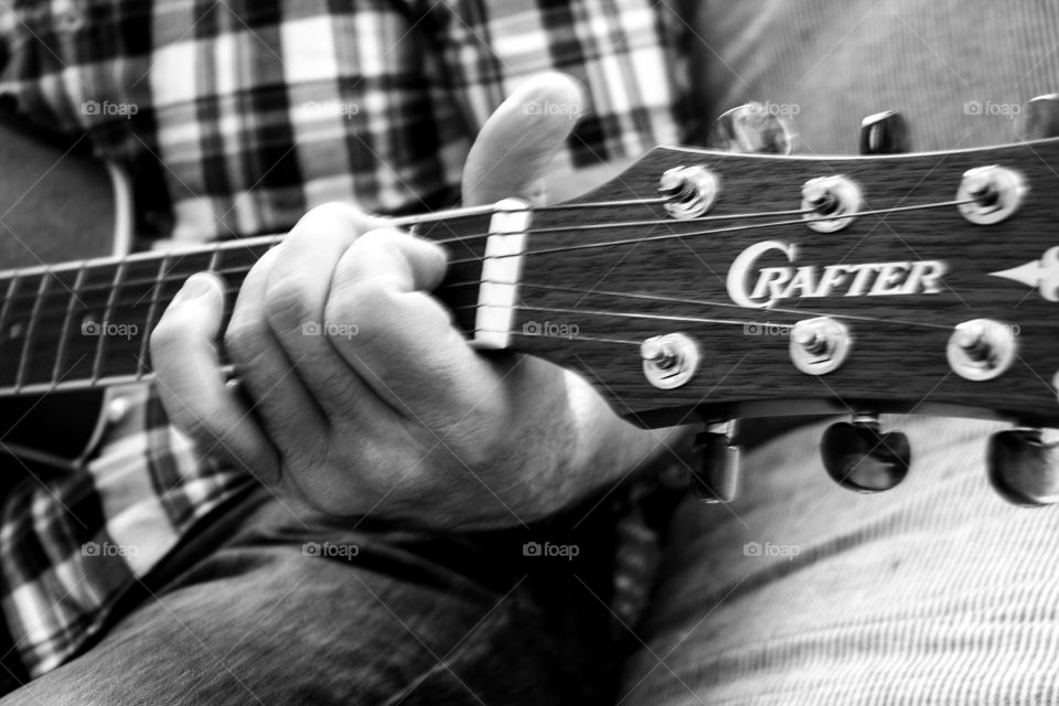 Playing guitar while at home during lockdown helps keep one calmer