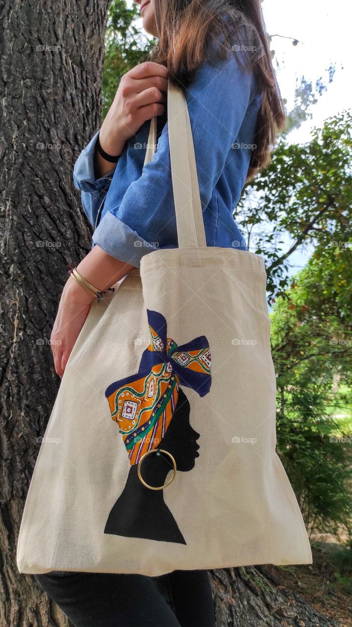 Hand painted canvas bag with handmade earring.