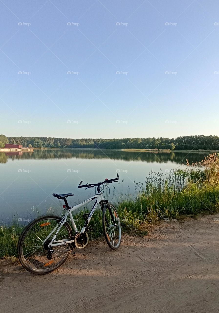 bike 🚲 on a rural road beautiful nature landscape lake shore