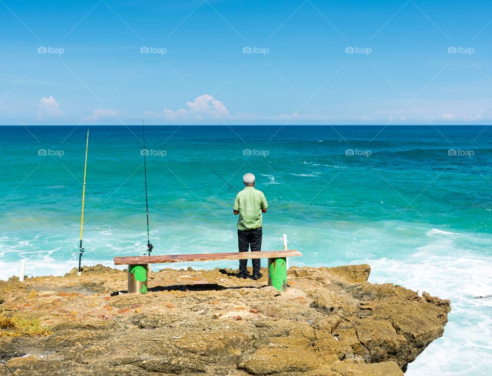 Fisherman by the sea