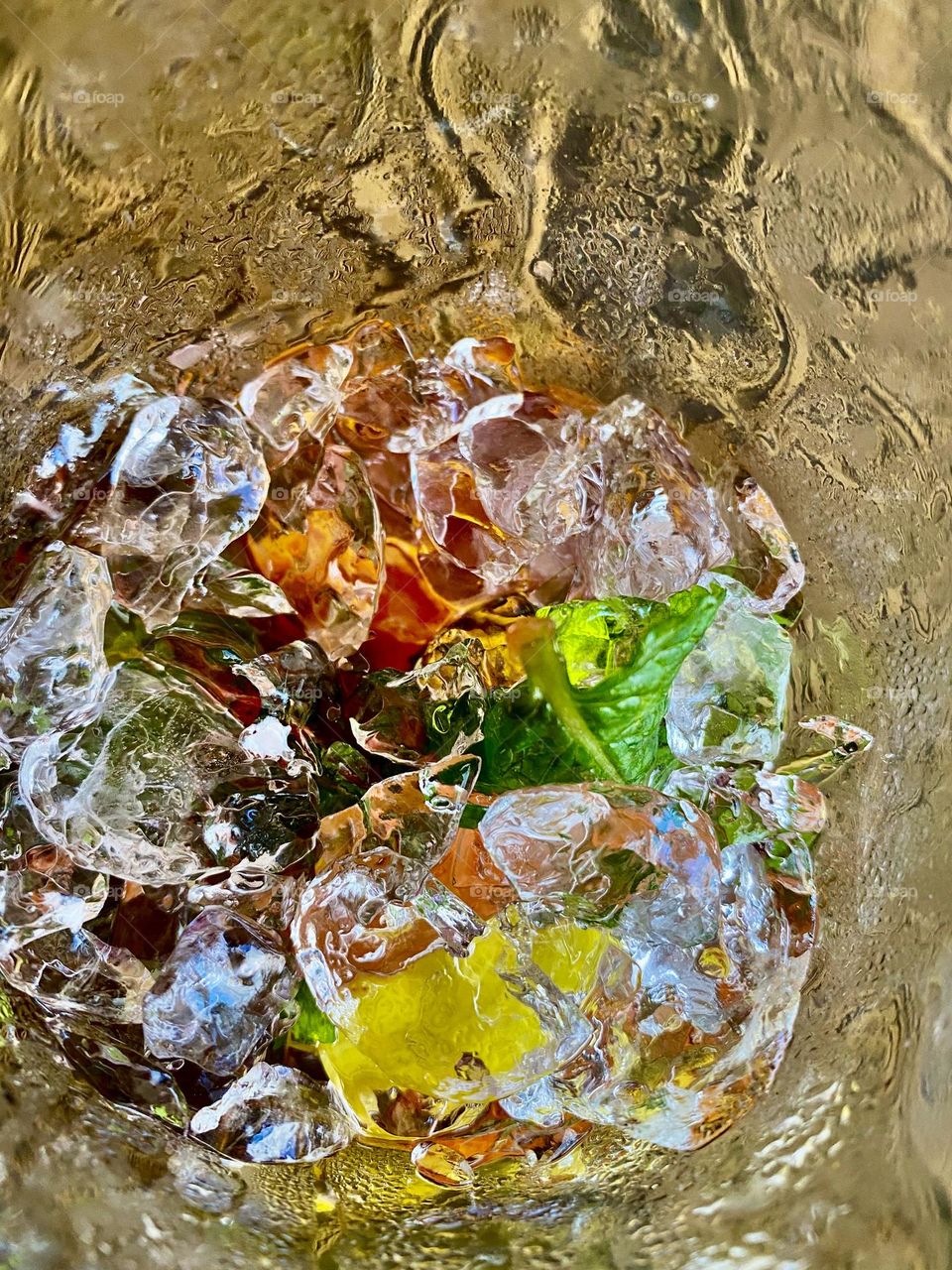 Ice at the bottom of a mojito glass