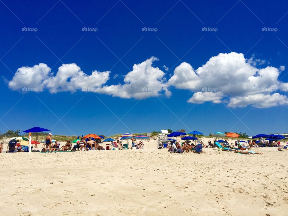 the  beach clouds. the beach clouds at Southampton's Coopers Beach on a clear, hot summer day in August 2015