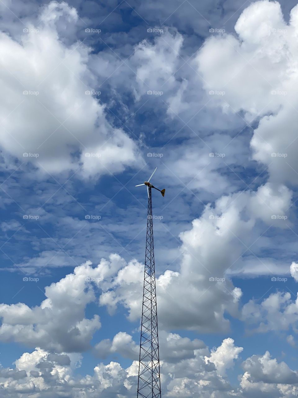 Wind power on windy, cloudy, summer day