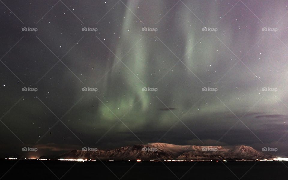 Aurora borealis in Iceland. amazing natural phenomenal. this is taken in the Reykjavik city which has strong light pollution yet the northern light still clearly visible