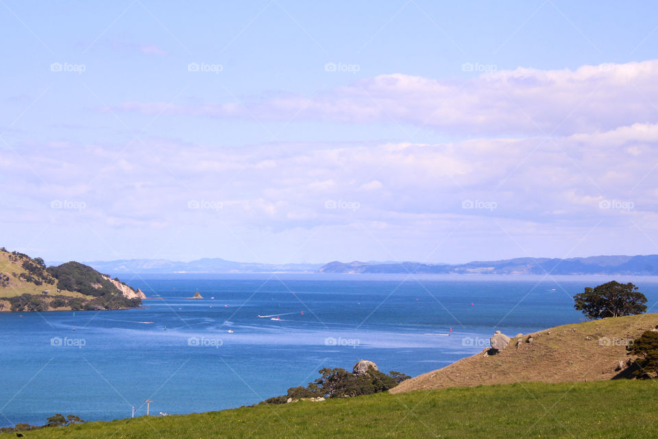 boats creating waves on the vivid blue water